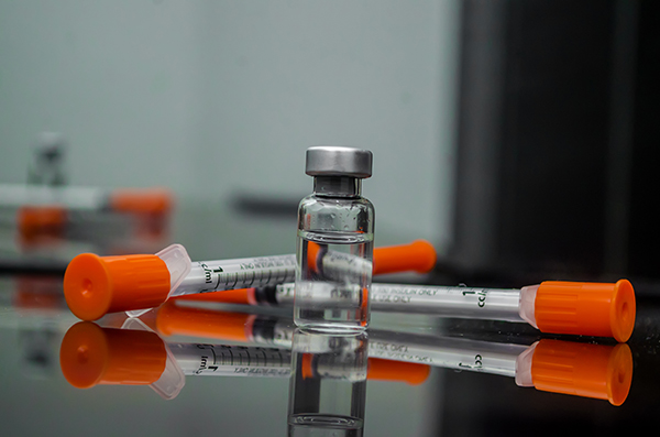 Vial of compounded semaglutide or tirzepatide, and two insulin syringes