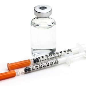Vial of compounder semaglutide, the active ingredient of Ozempic and two insulin syringes for administration