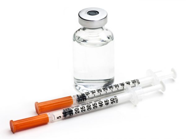 Vial of compounder semaglutide, the active ingredient of Ozempic and two insulin syringes for administration